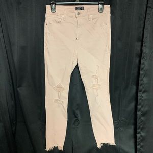 Light pink distressed denim